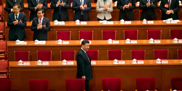 Chinese President Xi Jinping arrives for the closing session of the National People's Congress in Beijing's Great Hall of the People March 15, 2019. 