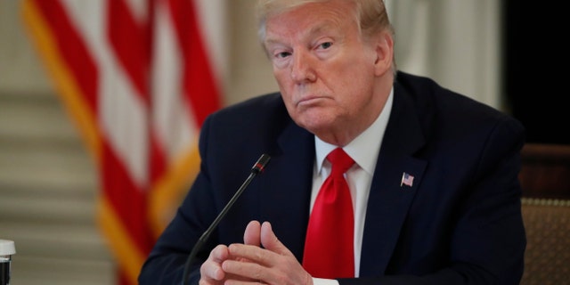 President Donald Trump speaks about reopening the country, during a roundtable with industry executives, in the State Dining Room of the White House April 29, in Washington. (AP Photo/Alex Brandon)