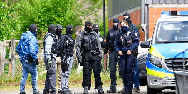 Special police investigates the Hezbollah linked Imam Mahdi center in Muenster, western Germany, Thursday, April 30, 2020. German police raided five sites linked to the Lebanese militant group Hezbollah, as authorities announced Thursday that they were banning activities by its political wing in Germany.