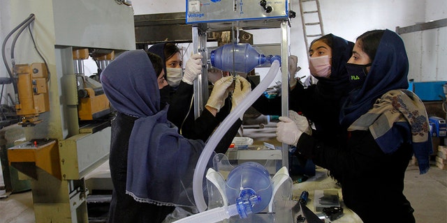 The robotics team had a limited number of special permits for cars. (AP Photo/Hamed Safarazi)