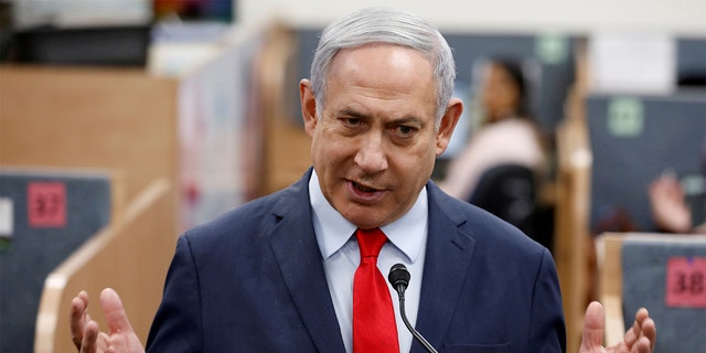 Israeli Prime Minister Benjamin Netanyahu gestures as he delivers a statement during his visit at the Health Ministry national hotline, in Kiryat Malachi, Israel last month. (REUTERS/Amir Cohen/File Photo)