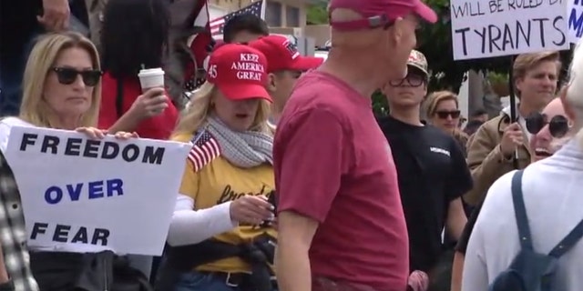 Demonstrators on Sunday in San Clemente, Calif. gathered to protest California's stay-at-home order meant to slow the spread of coronavirus.