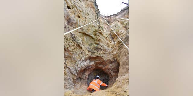 Archaeologists abseiled to the cave. (Archaeology South-East)