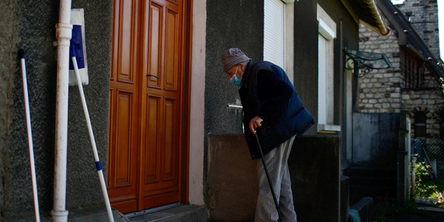 French doctor Christian Chenay, 98 year-old, arrives at his doctor's office in Chevilly-Larue near Paris as the spread of the coronavirus disease (COVID-19) continues in France April 14, 2020. Picture taken April 14, 2020. (REUTERS/Gonzalo Fuentes)