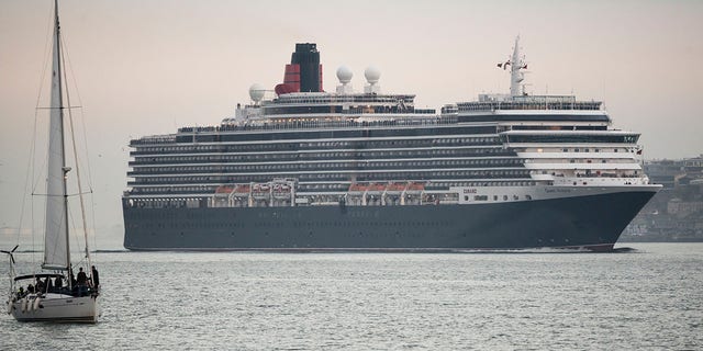 The MS Queen Victoria, seen here in January, outside of Lisbon, Portugal, is one of the three Cunard Cruises ships that will remain non-operational through the end of summer. Cunard is one of several other cruise lines, some of which are owned by Carnival and Norwegian, to recently extended its voluntary suspension of operations.