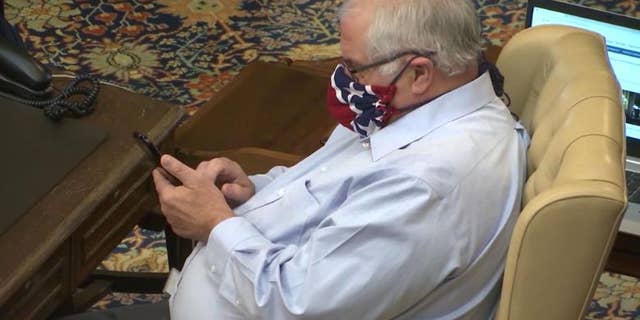 Michigan state Sen. Dale Zorn, a Republican, wearing a mask during a Senate vote Friday in Lansing (WLNS)