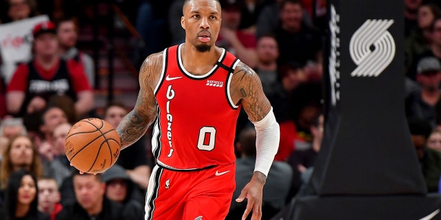 PORTLAND, OREGON - MARCH 10: Damian Lillard #0 of the Portland Trail Blazers brings the ball down the court during the second half of the game against the Phoenix Suns at the Moda Center on March 10, 2020 in Portland, Oregon. The Portland Trail Blazers topped the Phoenix Suns, 121-105. NOTE TO USER: User expressly acknowledges and agrees that, by downloading and or using this photograph, User is consenting to the terms and conditions of the Getty Images License Agreement. (Photo by Alika Jenner/Getty Images)