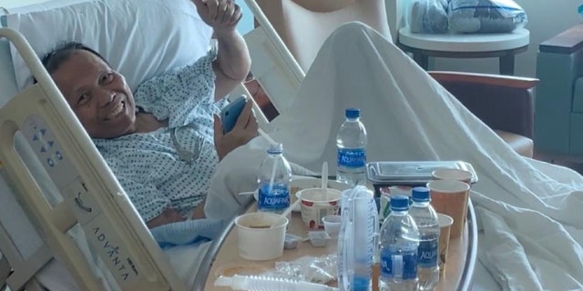 Dr. Manuel C Bulauitan recovering on the medical floor after downgrading from the ICU.