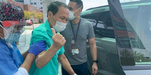 On the day of discharge, Dr. Bulauitan insisted on "walking the last few steps" to his car. He is assisted by his oldest son Major Dr. Constantine Bulauitan of the United States Army.