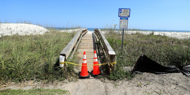 JACKSONVILLE BEACH, FLORIDA - MARCH 21: Police tape and pylons block the public access to Jacksonville Beach amid the coronavirus outbreak on March 21, 2020 in Jacksonville Beach, Florida. (Photo by Sam Greenwood/Getty Images)