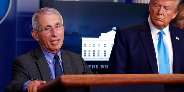 President Donald Trump listens as Dr. Anthony Fauci, director of the National Institute of Allergy and Infectious Diseases, speaks about the coronavirus in the James Brady Press Briefing Room of the White House, Tuesday, April 7, 2020, in Washington.