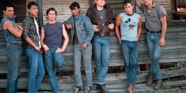 Tom Cruise, Rob Lowe, C. Thomas Howell, Ralph Macchio, Matt Dillon, Emilio Estevez and Patrick Swayze on the set of 'The Outsiders,' directed and produced by Francis Ford Coppola. 