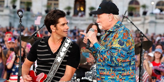 Emmy nominated actor John Stamos (L) performs with Mike Love of The Beach Boys at A Capitol Fourth at U.S. Capitol, West Lawn on July 4, 2017, in Washington, DC.