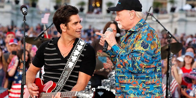 Emmy nominated actor John Stamos (L) performs with Mike Love of The Beach Boys at A Capitol Fourth at U.S. Capitol, West Lawn on July 4, 2017, in Washington, DC.