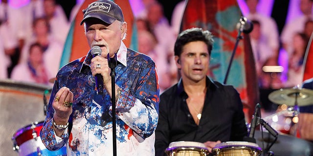 Emmy Award-nominated actor and producer and host John Stamos (R) performs with Mike Love of The Beach Boys at the 2018 A Capitol Fourth rehearsals sat U.S. Capitol, West Lawn on July 3, 2018, in Washington, DC.