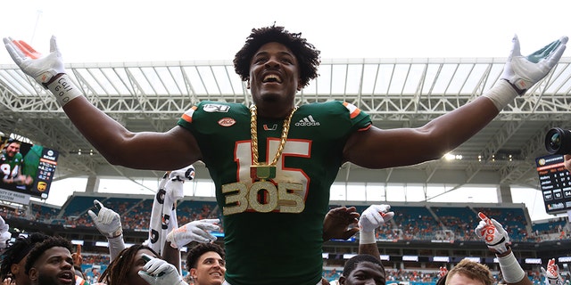 Sep 21, 2019; Miami Gardens, FL, USA; Miami Hurricanes defensive lineman Gregory Rousseau (15) celebrates wearing the turnover chain during the first quarter of a football game against the Central Michigan Chippewas at Hard Rock Stadium.