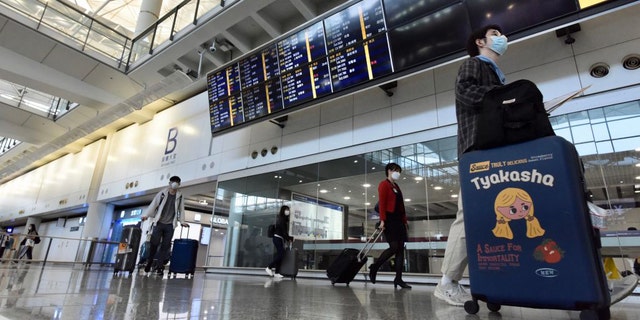 A new mandate, announced by the Hong Kong government on Tuesday, reportedly makes Hong Kong the first airport in the world to require testing for all incoming passengers. (Li Zhihua/China News Service via Getty Images)