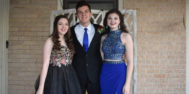 Grayson, left, is pictured with siblings Crae and Maura Chapman.