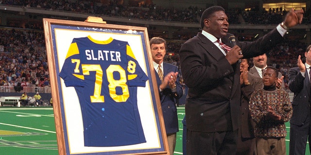 Former Los Angeles Rams tackle Jackie Slater speaking at a ceremony for retiring his jersey (#78) during halftime of a game against the Green Bay Packers on November 24, 1996. (Photo by Sporting News via Getty Images/Sporting News via Getty Images)