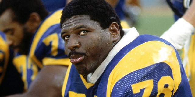 Offensive tackle Jackie Slater #78 of the Los Angeles Rams sits on the bench during a football game at Anaheim Stadium in Anaheim, California. Slater played for the Rams from 1976-95. (Photo by Andrew D. Bernstein/Getty Images)