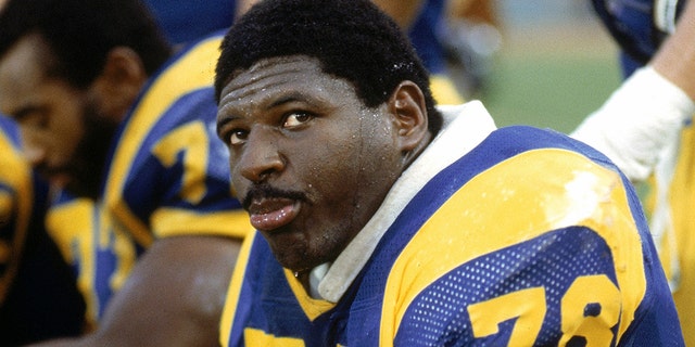 Offensive tackle Jackie Slater of the Los Angeles Rams sits on the bench during a game at Anaheim Stadium in Anaheim, California. Slater played for the Rams from 1976-95. (Photo by Andrew D. Bernstein/Getty Images)