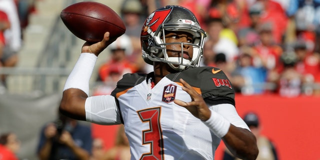 FILE - In this Sept. 13, 2015, file photo, Tampa Bay Buccaneers quarterback Jameis Winston (3) looks to throw the ball during the first half of an NFL football game against the Tennessee Titans in Tampa, Fla. 