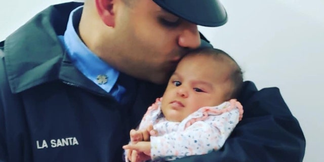 FDNY firefighter Jerel La Santa with his daughter Jay-Natalie.