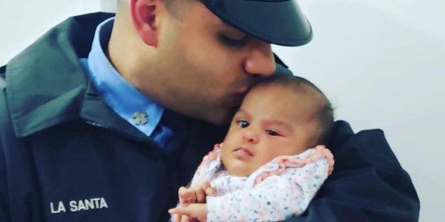 FDNY firefighter Jerel La Santa with his daughter Jay-Natalie.