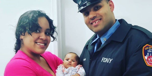 FDNY firefighter Jerel La Santa and Lindsey Mahala with Jay-Natalie.