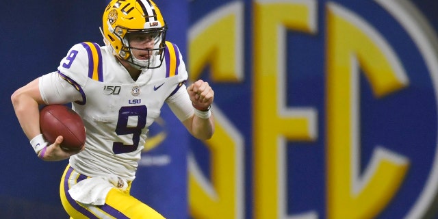 FILE - In this Dec. 7, 2019, file photo, LSU quarterback Joe Burrow (9) runs against Georgia during the second half of the Southeastern Conference championship NCAA college football game, in Atlanta. The Southeastern Conference broke the NFL record for first-round draft picks by a conference. Fifteen players from the powerhouse league were selected in the opening round Thursday night, April 23, 2020. (AP Photo/Mike Stewart, File)