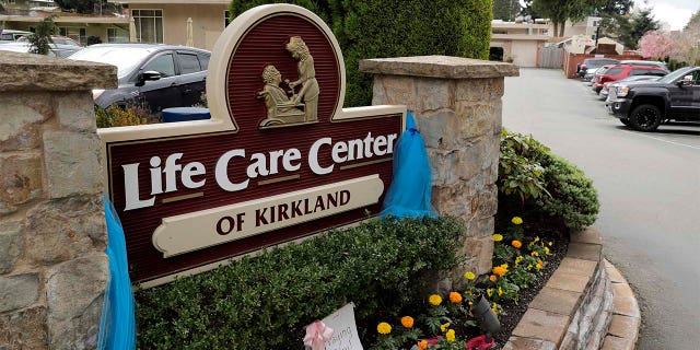 An entrance sign is shown at the Life Care Center in Kirkland, Washington. Federal authorities on Wednesday proposed a fine of more than $600,000 for the Seattle-area nursing home connected to the deaths of 37 residents. (AP Photo/Ted S. Warren)