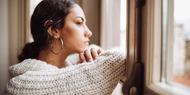A woman on Reddit — a mom of three (not pictured) — said she's struggling with her husband's wish to move his grieving father into their family home.