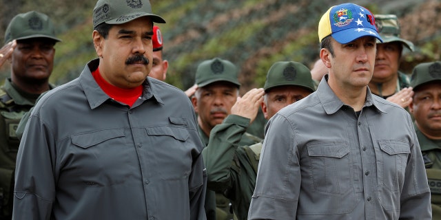 Venezuela's President Nicolas Maduro, Venezuela's Vice President Tareck El Aissami and Cilia Flores take part in a military exercise at Fuerte Tiuna military base in Caracas, Venezuela February 24, 2018. REUTERS/Marco Bello - RC17D57B06D0