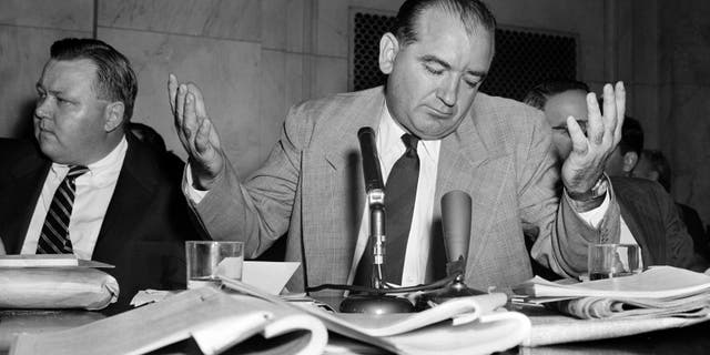 Sen. Joseph McCarthy, R-Wis., gives a resigned shrug at being unable to get across with one of his "point of order" interruptions, during the Senate Investigation Subcommittee hearing, in Washington, D.C., April 30, 1954. Pvt. G. David Schine was in the witness chair at the time. (AP Photo/WF)