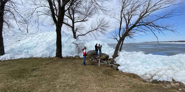 The occurrence is a result of heavy winds pushing leftover ice into piles on lakefront areas.