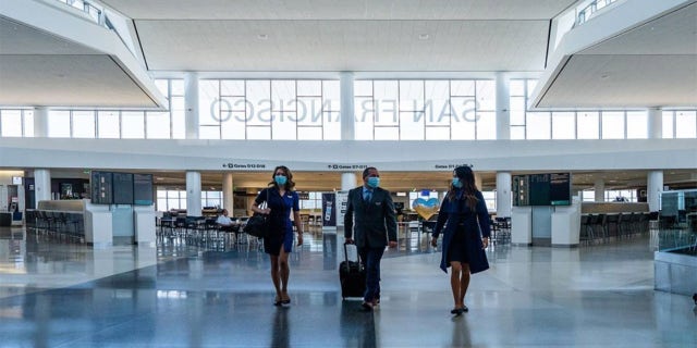 In one of her photos shared to her Instagram account, Molly Choma shows herself and some coworkers walking through a mostly empty San Francisco International Airport.