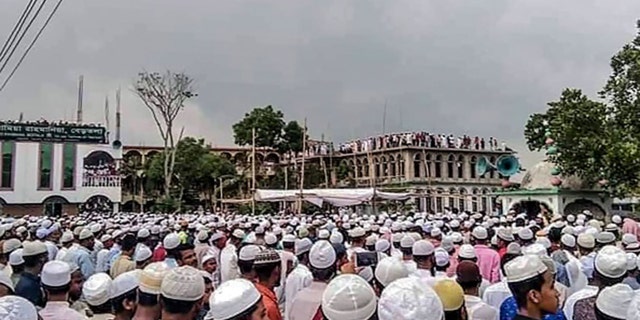 Muslim devotees attend a funeral prayer for an Islamic preacher during a government-imposed nationwide lockdown as a preventive measure against the COVID-19 coronavirus, in Brahmanbaria also known as Sarail on April 18, 2020. - Tens of thousands of people defied a nationwide coronavirus lockdown in Bangladesh on April 18 to attend the funeral of a top Islamic preacher, even as authorities battle a surge in virus cases. (Photo by STR / AFP) / To go with 'BANGLADESH-PANDEMIC-ISLAM' (Photo by STR/AFP via Getty Images)