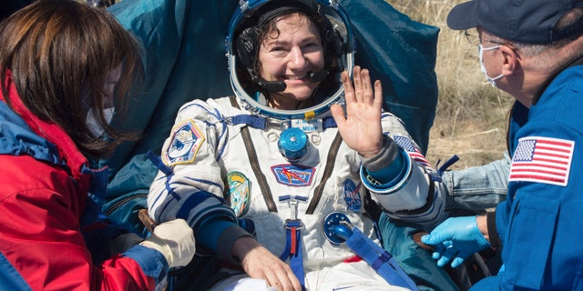 U.S. astronaut Jessica Meir waves shortly after the landing of the Russian Soyuz MS-15 space capsule near Kazakh town of Dzhezkazgan, Kazakhstan, Friday, April 17, 2020.