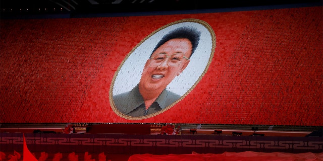 Participants form a portrait of Kim Jong Il during Mass Games in May Day stadium marking the 70th anniversary of North Korea's foundation in Pyongyang. (REUTERS/Danish Siddiqui)