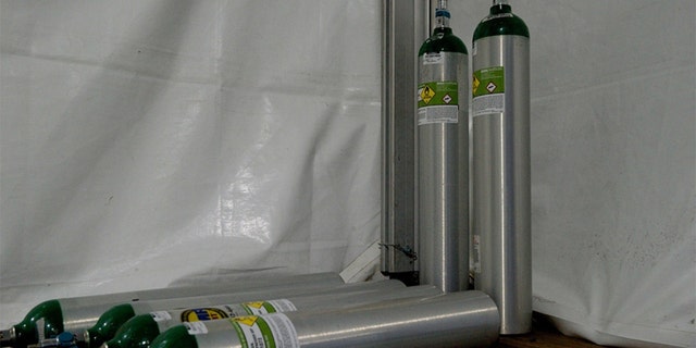 Medical grade oxygen tanks utilized by the patient transport team aboard the USNS Comfor hospital ship. (U.S. Navy photo by Ensign James Caliva)