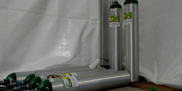 Medical grade oxygen tanks utilized by the patient transport team aboard the USNS Comfor hospital ship. (U.S. Navy photo by Ensign James Caliva)