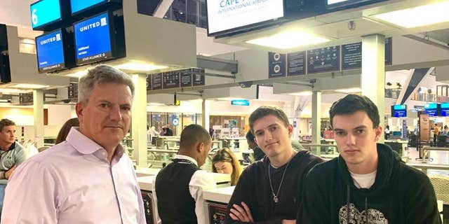 David Berman and his sons Jacob and Josh at the airport in Cape Town, South Africa. They had been on standby to leave on the last flight to New York before the country's coronavirus lockdown began.