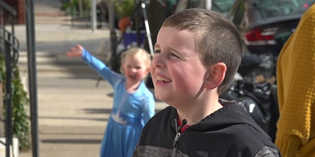 Eight-year-old Cooper O'Malley and his little sister Callen marvel at a rainbow hunting in the Fishtown neighborhood of Philadelphia.