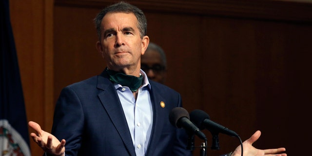 Virginia Governor Ralph Northam gestures while answering a question during his press briefing inside the Patrick Henry Building in Richmond, Va., Monday, April 20, 2020. (Bob Brown/Richmond Times-Dispatch via AP)