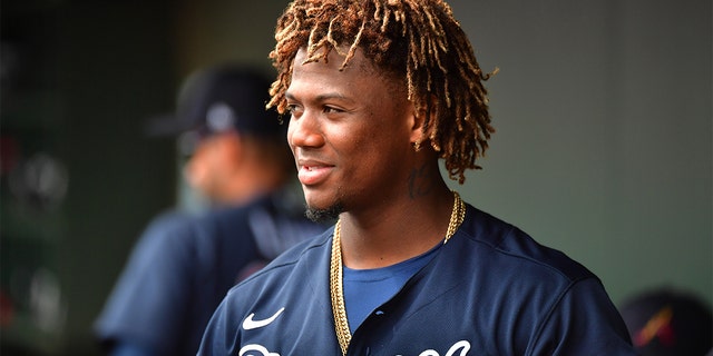 Ronald Acuna Jr. #13 of the Atlanta Braves looks on from the dugout during the fourth inning of a spring training baseball game against the Baltimore Orioles at Ed Smith Stadium on February 26, 2020 in Sarasota, Florida. (Photo by Julio Aguilar/Getty Images)