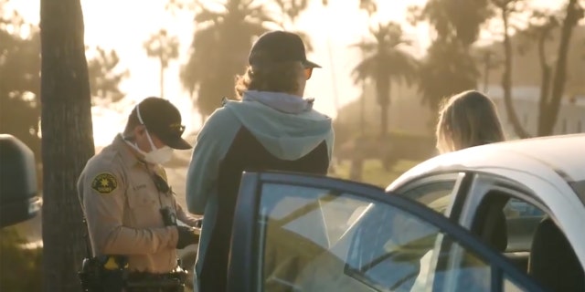 Tickets were issued to 22 people who were "watching the sunset, having picnics near the beach" in Encinitas, Calif. on Friday, according to officials.