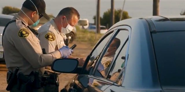 Tickets were issued to 22 people who were "watching the sunset, having picnics near the beach" in Encinitas, Calif. on Friday, according to officials.