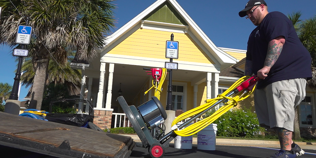 A cleaning crew member prepares to sanitize the inside of one of the recreation centers located at The Villages (Robert Sherman, Fox News).