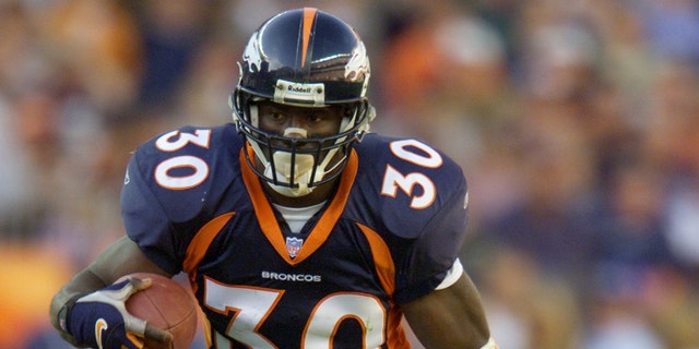 Terrell Davis of the Denver Broncos heads downfield against the San Diego Chargers during the game at Invesco Field at Mile High Stadium in Denver, Colorado. The Broncos won 26-16. (Brian Bahr/Allsport)