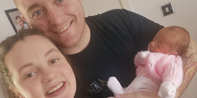 Baby Peyton with her parents.
